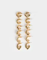 Set de seis pares de aros argollas doradas con diferentes diseños.