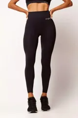 Calza deportiva negra de tiro alto, sin costuras y con diseño texturizado.