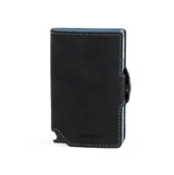 Billetera compacta de cuero negro con costuras contrastantes en azul claro. Presenta un mecanismo de apertura lateral y un detalle en la parte inferior que funciona como abridor de botellas. El nombre de la marca "BALEINE" está grabado en la parte inferior frontal.