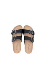Sandalias negras con dos tiras anchas con hebillas ajustables, plantilla de corcho y suela plana con ribete de yute.