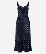 Vestido midi evasé sin mangas, confeccionado en tejido airflow con estampado de caracolas. Presenta escote corazón, breteles medianos con elásticos, recortes fruncidos en la cintura y en el bajo, y cierre lateral con cremallera invisible.