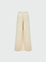 Pantalón de algodón color crema, de corte ancho y cintura elástica.