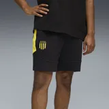 Shorts deportivos negros con detalles en amarillo y escudo del Club Atlético Peñarol bordado en la pierna izquierda.