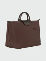 Bolso de viaje grande Longchamp Le Pliage Green XL, color verde jade, con doble asa corta y cierre superior con cremallera y botón a presión.