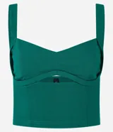 Top cropped de color verde esmeralda, confeccionado en bengalina de viscosa certificada. Presenta escote corazón con un detalle de abertura en el busto y breteles anchos.