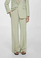 Pantalón de vestir color verde claro, de corte palazzo y tiro alto.