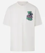 Remera color crema de corte relaxed, con cuello redondo y mangas cortas. Presenta un estampado de un pulpo y letras con la frase "Too weird for earth".