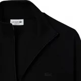 Campera deportiva Lacoste negra con cierre frontal, cuello alto y bolsillos laterales.