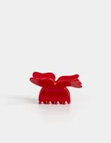 Broche para el pelo rojo con forma de moño.