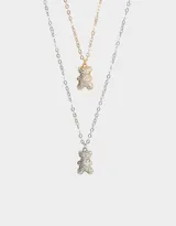 Set de dos collares cortos con dije de oso cubierto de strass, uno plateado y otro dorado.