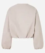 Campera bomber color beige con cuello y puños en color borgoña. Cierre frontal con cremallera y bolsillos laterales.