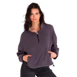 Buzo polar verde oscuro de microfleece, con cierre medio frontal con tirador con logo de Cat, bolsillo tipo canguro con costura divisoria, banda ajustable y parche de silicona con el logo de Caterpillar en el pecho izquierdo.