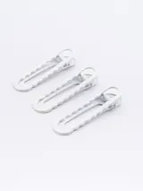 Set de tres pinzas para el pelo color blanco con diseño ondulado.