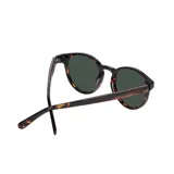 Lentes de sol redondos con montura de carey y lentes grises. Fabricados con madera y eco acetato.