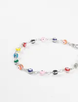 Pulsera dorada con cadena de eslabones y dijes de ojitos turcos de colores.