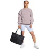 Bolso tote Under Armour Studio, color negro, con logo frontal y bolsillo de red con cierre.