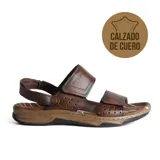 Sandalias de cuero marrón con doble tira con velcro y suela marrón con detalles en negro.