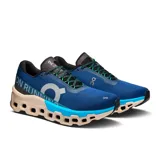 Championes de running On Running Cloudmonster 2, color azul con detalles en gris, negro y beige.