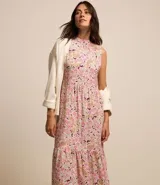 Vestido largo evasê de viscosa con estampado floral paisley, cuello redondo y sin mangas.