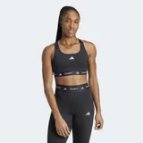 Top deportivo Adidas Techfit negro con logo blanco y banda elástica con la inscripción "TECHFIT" en blanco.