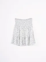 Minifalda con estampado geométrico en blanco y azul marino.