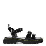Sandalias blancas con tiras de cuero sintético con tachas plateadas en forma de estrella, hebilla lateral y suela track color negro.