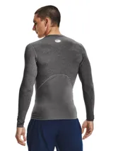 Remera de compresión Under Armour HeatGear de manga larga, color negro con logo blanco en el pecho.