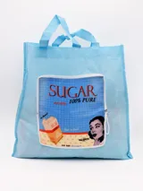 Bolso de tela celeste con asas y estampado vintage de la marca Sugar.
