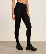 Calza legging deportiva color verde agua, de microfibra, con cintura ancha y bolsillos laterales.