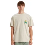 Remera color beige con estampado de un girasol en el pecho.