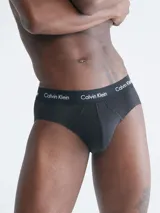 Pack de tres slips negros de algodón elástico con cintura elástica con logo Calvin Klein.