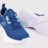 Championes deportivos Skechers Arch Fit Infinity color azul con cordones y suela blanca.
