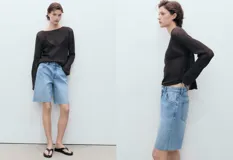 Short de jean azul de tiro medio con cierre de cremallera y botón, cinco bolsillos, diseño recto y bajo deshilachado.