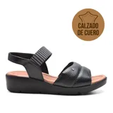 Sandalias de cuero negro con plataforma baja y tira elástica estampada en el empeine.