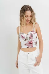 Top tipo corset con estampa floral, confeccionado en tul elástico con estructura interna y copas armadas. Breteles regulables y cierre con triple hilera de broches en espalda.