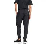 Pantalón de jogging negro de tejido ligero con tecnología NB DRY de secado rápido, cintura elástica con cordón, bolsillos laterales y dobladillo inferior elástico.