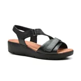 Sandalias de cuero negras con plataforma baja, tiras anchas con ajuste de velcro y plantilla acolchada. Cuentan con tecnología Low Impact para absorción de impactos.