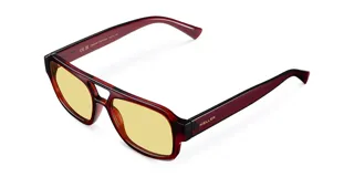 Lentes de sol de aviador oversize con montura marrón y lentes amarillas.