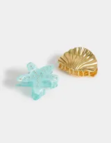 Set de dos broches para el pelo, uno dorado con forma de concha marina y otro blanco con forma de estrella de mar con incrustaciones de strass.