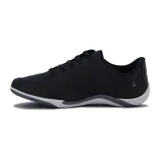Zapatillas urbanas Kolosh negras con cordones y cierre lateral, detalles de perforaciones y apliques brillantes.