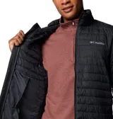 Campera negra acolchada para hombre, marca Columbia, modelo Silver Falls II. Confeccionada con tejido resistente al agua y tecnología Omni-Shield™ que repele la humedad y las manchas. Cuenta con aislamiento Thermarator™ de poliéster reciclado, bolsillos con cremallera, puños elásticos y dobladillo ajustable con cordón.