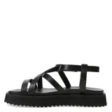 Sandalias blancas con tiras finas cruzadas y suela track color negro.
