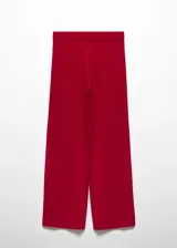 Pantalón de punto fino color negro, con diseño fluido y cintura elástica de corte wideleg.