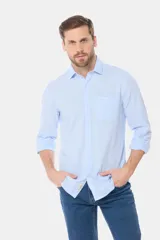 Camisa de lino blanca de manga larga, con bolsillo en el pecho con logo bordado y botones personalizados.