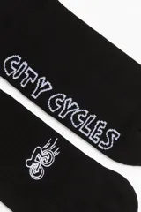Par de medias negras de caña alta con logo de bicicleta y texto 'City Cycles' en blanco.