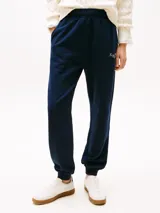Pantalón de jogging azul marino de algodón con cintura y tobillos elastizados y logo bordado en blanco.