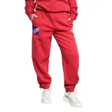 Pantalón de jogging azul con puños ajustados, bolsillos laterales y logo de Umbro y escudo del Club Nacional de Football estampados.