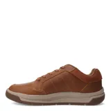 Zapato acordonado de cuero color marrón con detalles en gamuza en el talón. Suela de goma color beige y marrón.
