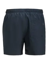 Short de baño azul marino con cintura elástica, cordón ajustable, bolsillos delanteros y trasero. Confeccionado en tejido plano de nylon y poliéster.