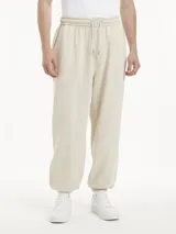 Jogger beige de Calvin Klein con corte relajado, cintura elástica y puños elásticos.